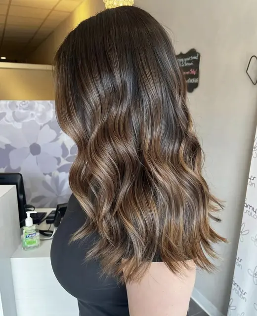 Brunette waves with soft caramel balayage
